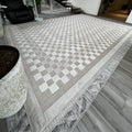 Alfombra Ankara Polonia Doral, damero de cuadrados en blanco y gris