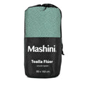 Toalla Flúor Deportiva Mashini en su bolsa con cordón